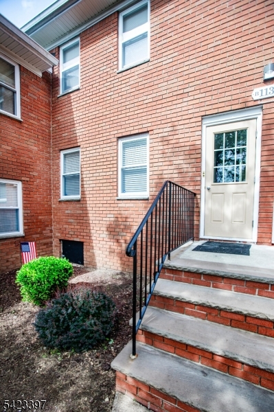 1130 Valley Road, Unit 2B Wayne, NJ 07470 - Photo 34 of 47 a view of a house with stairs and a floor to ceiling window and wooden fence