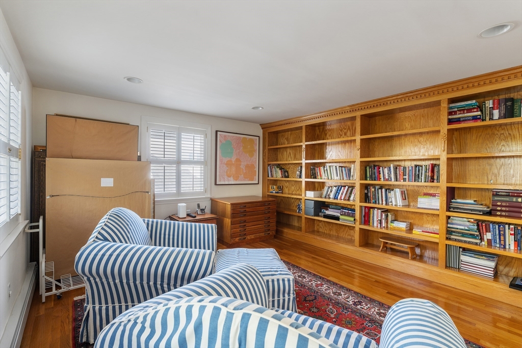 10 Redstone Lane Marblehead, MA 01945 - Photo 22 of 31 a bedroom with furniture and a book shelf