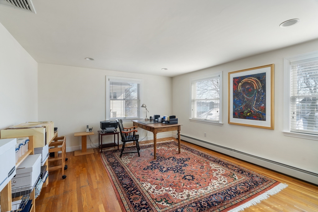 10 Redstone Lane Marblehead, MA 01945 - Photo 23 of 31 a living room with a couch and a rug