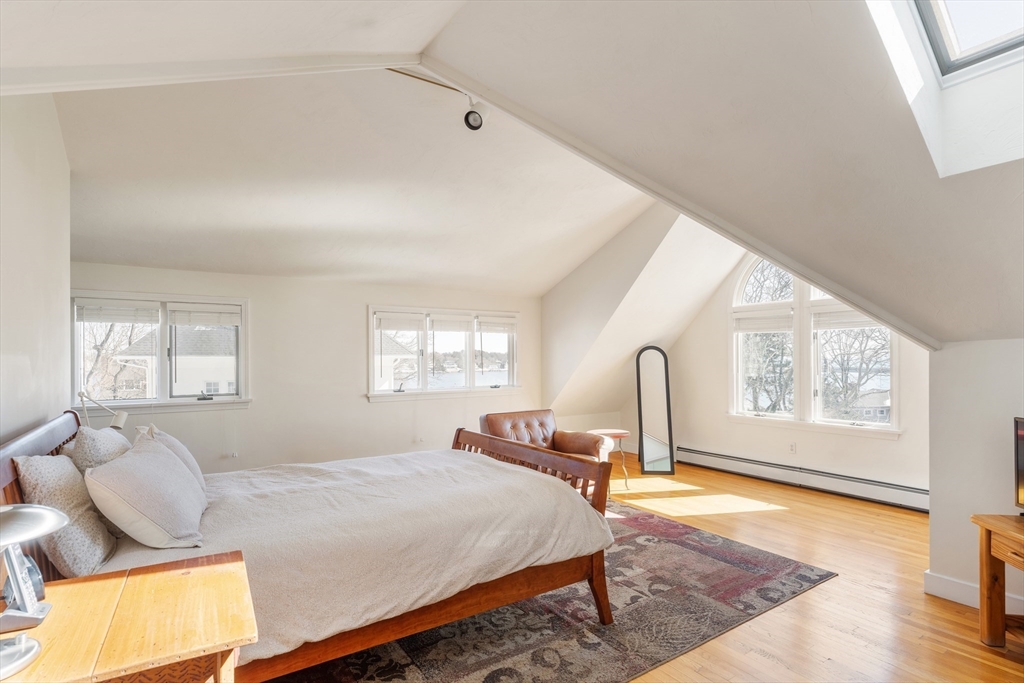 10 Redstone Lane Marblehead, MA 01945 - Photo 25 of 31 a bedroom with a bed and wooden floor