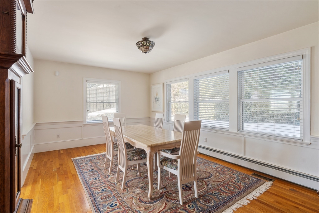 10 Redstone Lane Marblehead, MA 01945 - Photo 9 of 31 a view of a dining room with furniture and wooden floor