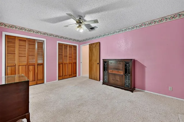 a view of an empty room with a fireplace