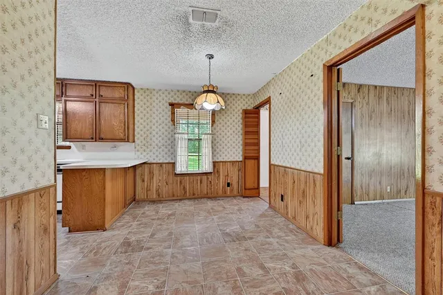 a view of a bathroom with a tub and windows