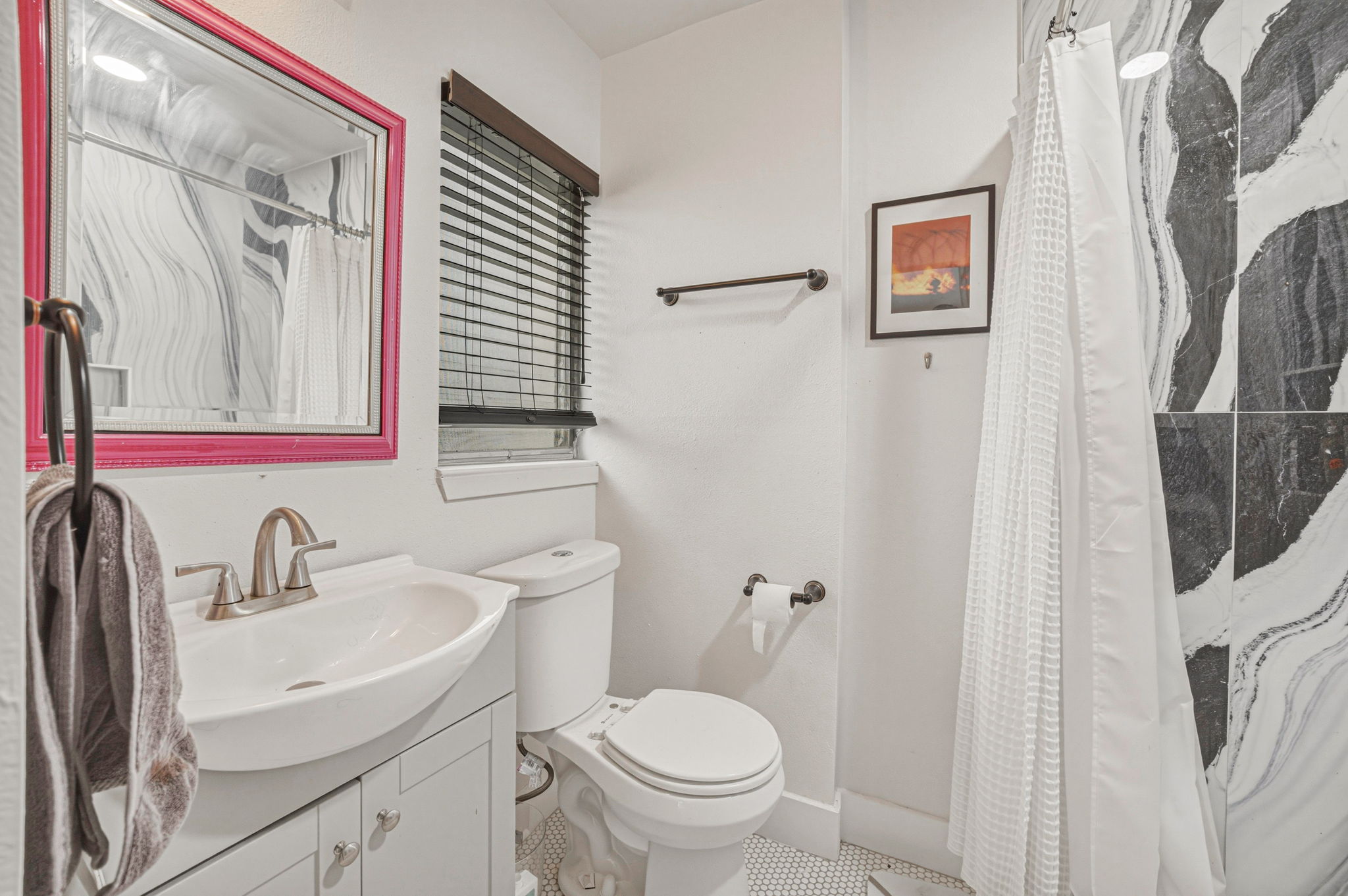 5332 Balcones Drive, Unit B Austin, TX 78731 - Photo 11 of 15 Bathroom featuring a vanity with a white sink, a toilet, and a tiled shower with a white shower curtain
