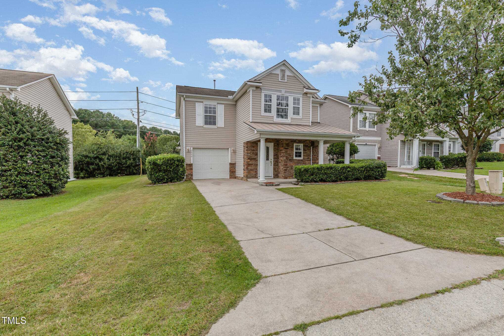 2640 Quarry Springs Road Raleigh, NC 27610 - Photo 15 of 31 a front view of a house with garden