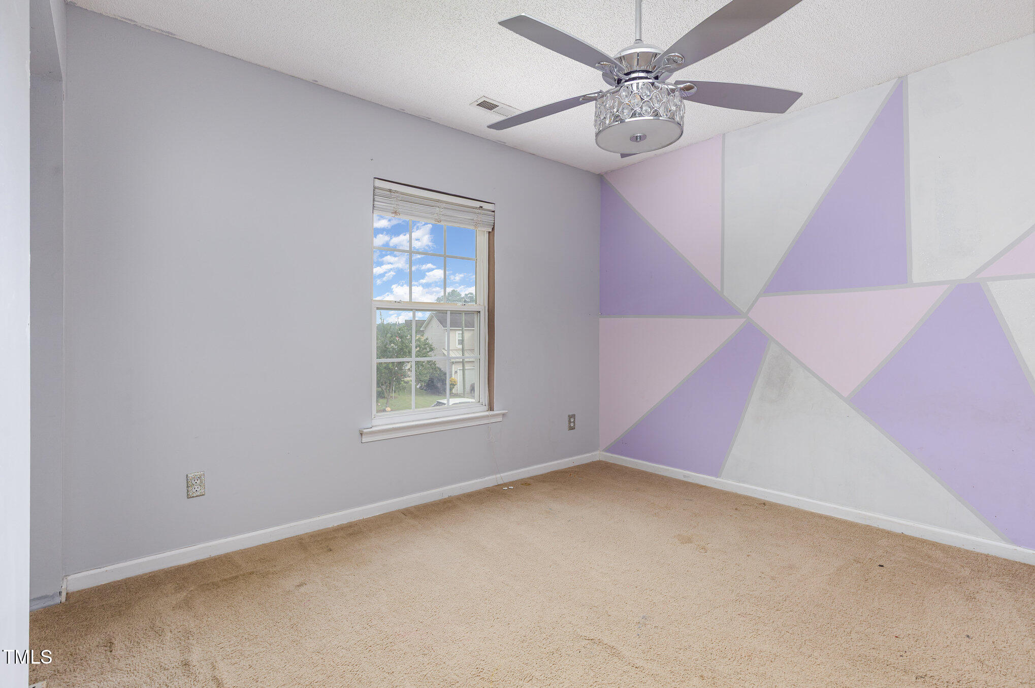 2640 Quarry Springs Road Raleigh, NC 27610 - Photo 24 of 31 a view of an empty room with a window