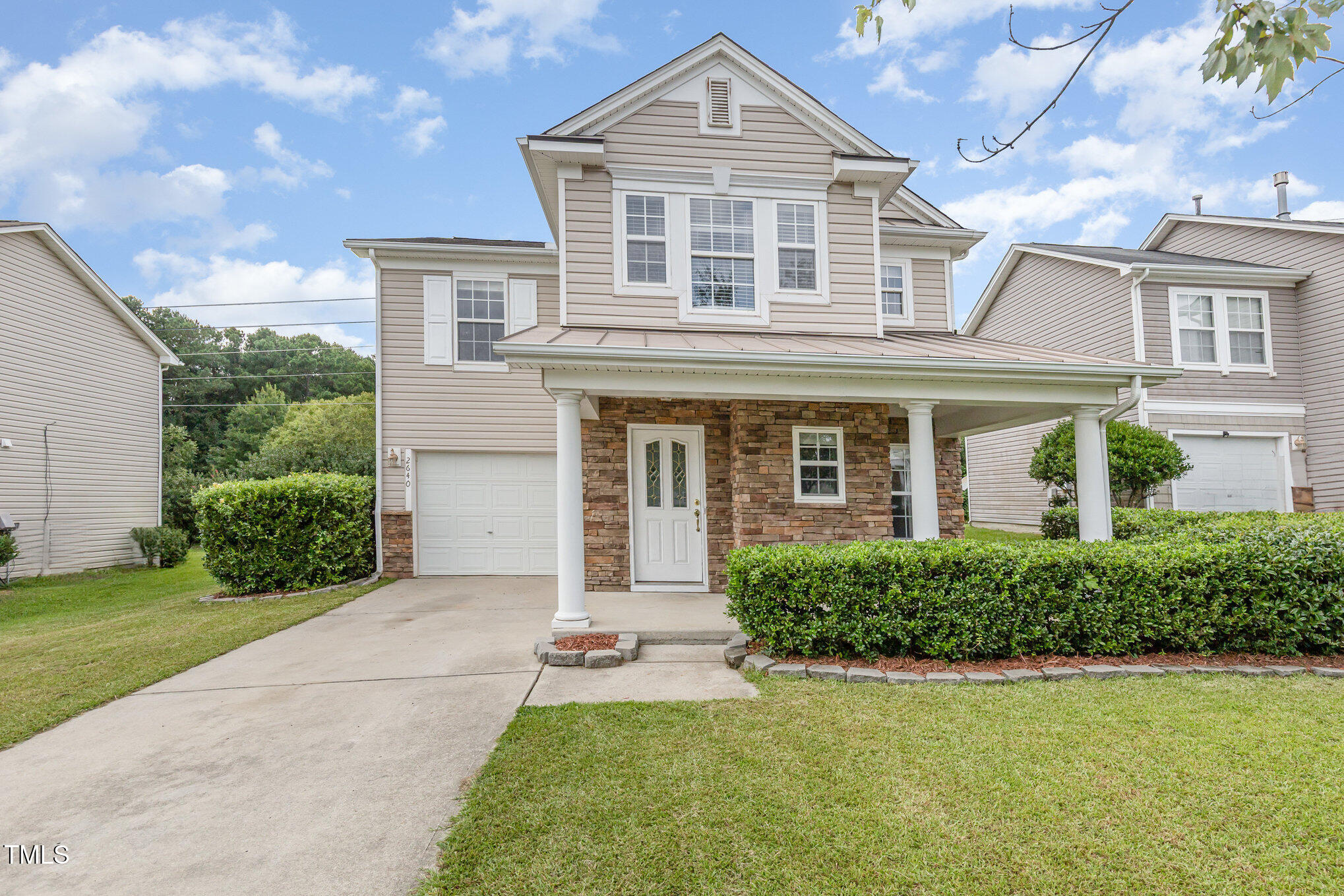 2640 Quarry Springs Road Raleigh, NC 27610 - Photo 2 of 31 front view of a house with a yard
