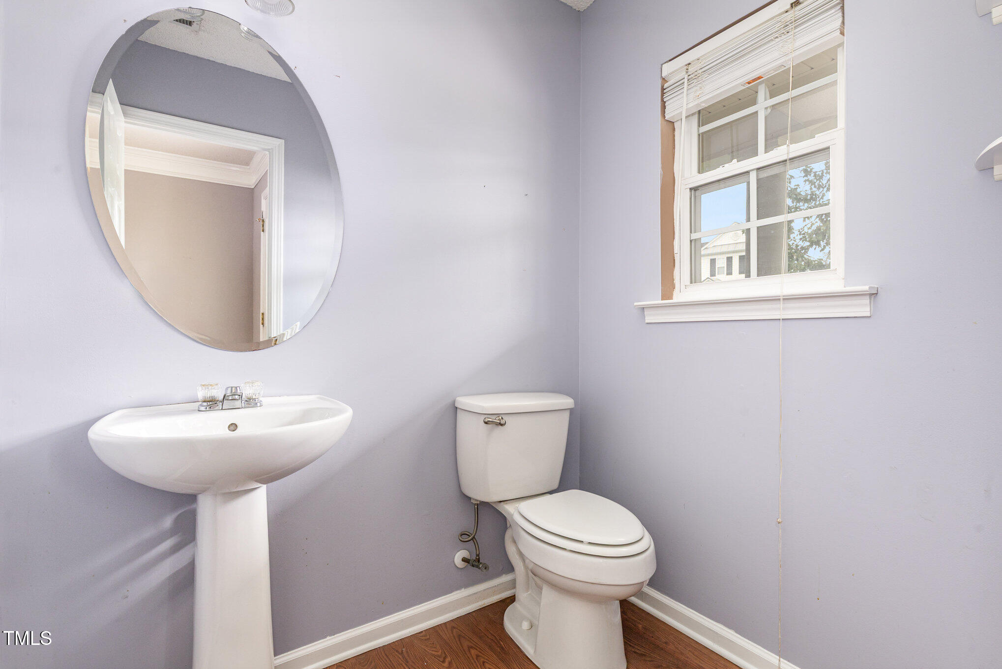2640 Quarry Springs Road Raleigh, NC 27610 - Photo 8 of 31 a bathroom with a toilet sink and mirror
