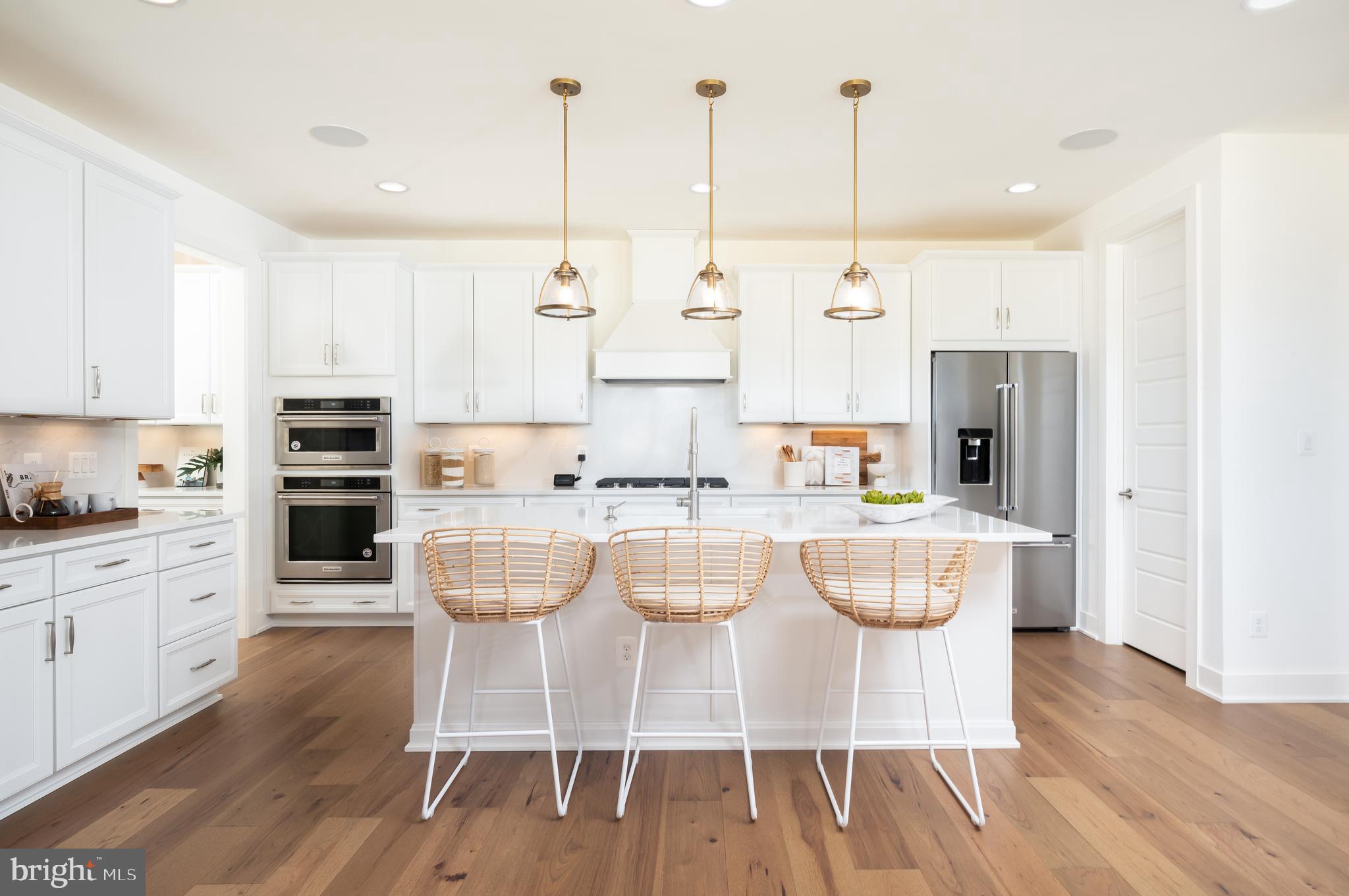 42108 Creighton Road Ashburn, VA 20148 - Photo 12 of 39 a kitchen with stainless steel appliances granite countertop a white cabinets and a stove