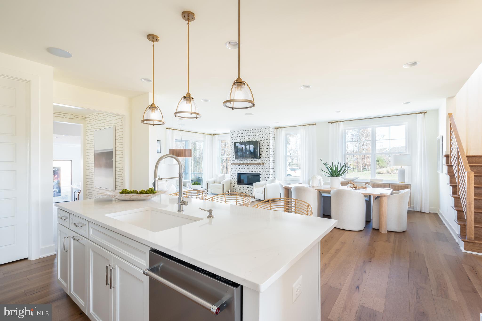 42108 Creighton Road Ashburn, VA 20148 - Photo 14 of 39 a very nice looking dining room with a large center island and couches