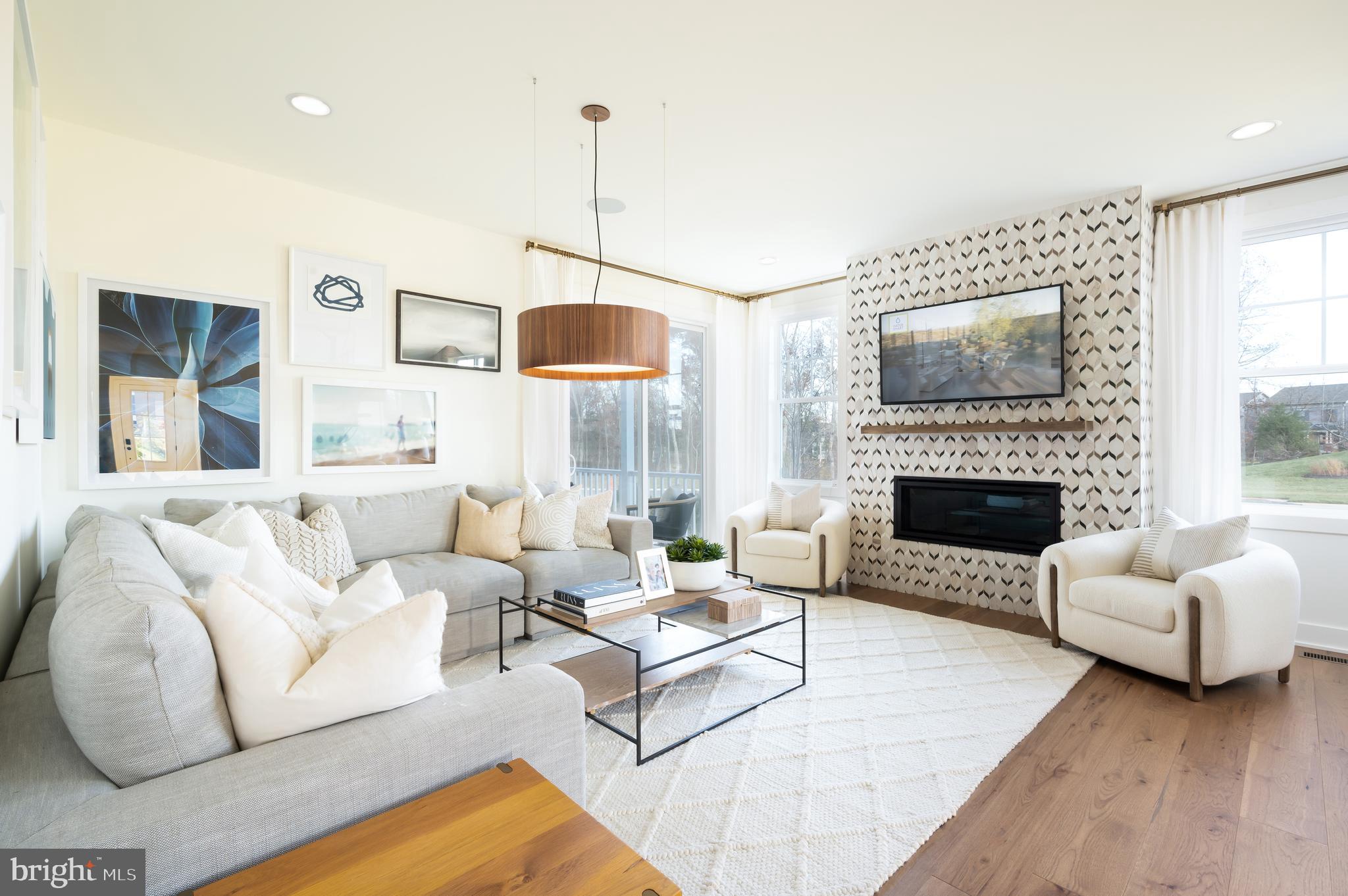 42108 Creighton Road Ashburn, VA 20148 - Photo 18 of 39 a living room with furniture fireplace and window