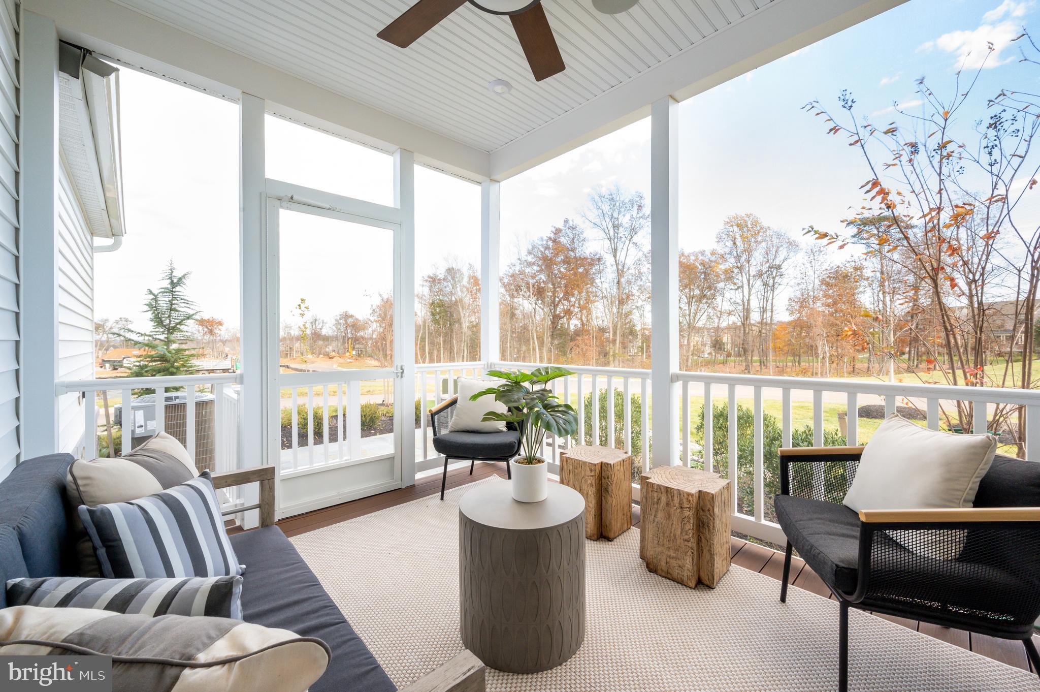 42108 Creighton Road Ashburn, VA 20148 - Photo 20 of 39 a living room with furniture and a large window