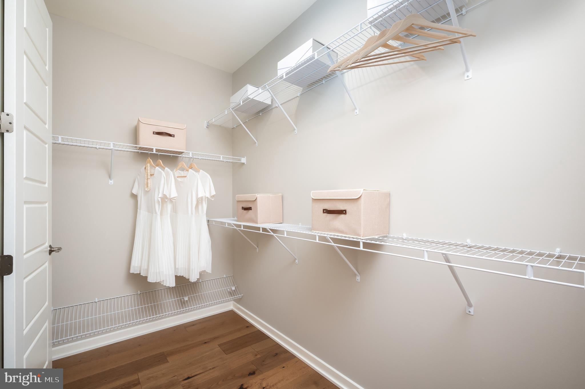 42108 Creighton Road Ashburn, VA 20148 - Photo 23 of 39 a view of a room with wooden floor and white walls