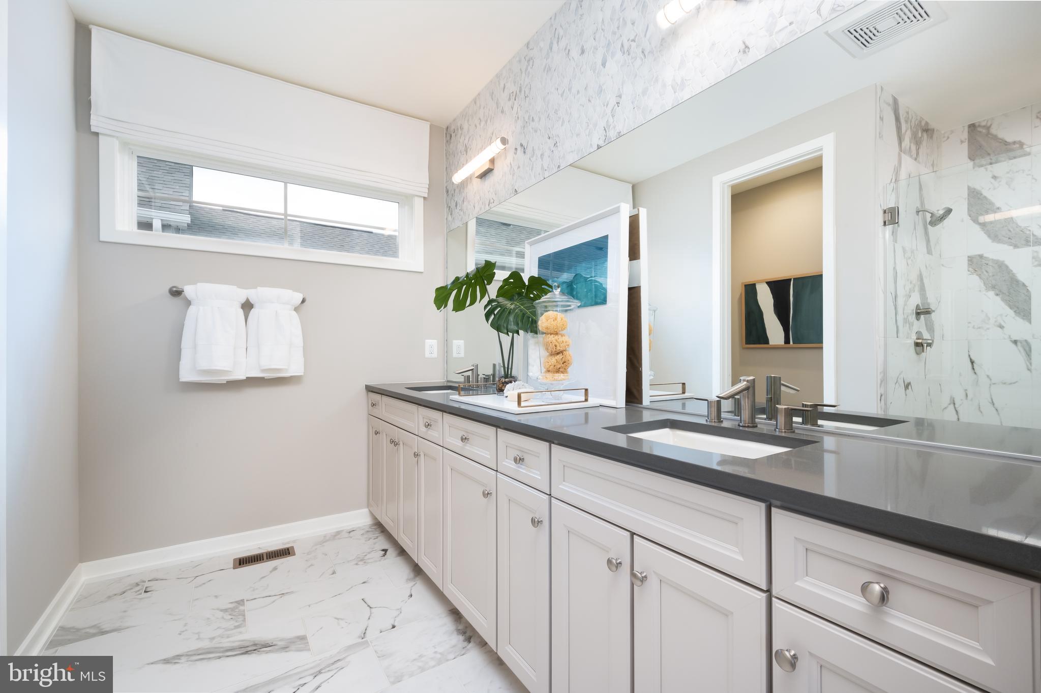 42108 Creighton Road Ashburn, VA 20148 - Photo 24 of 39 a bathroom with a granite countertop sink mirror and a