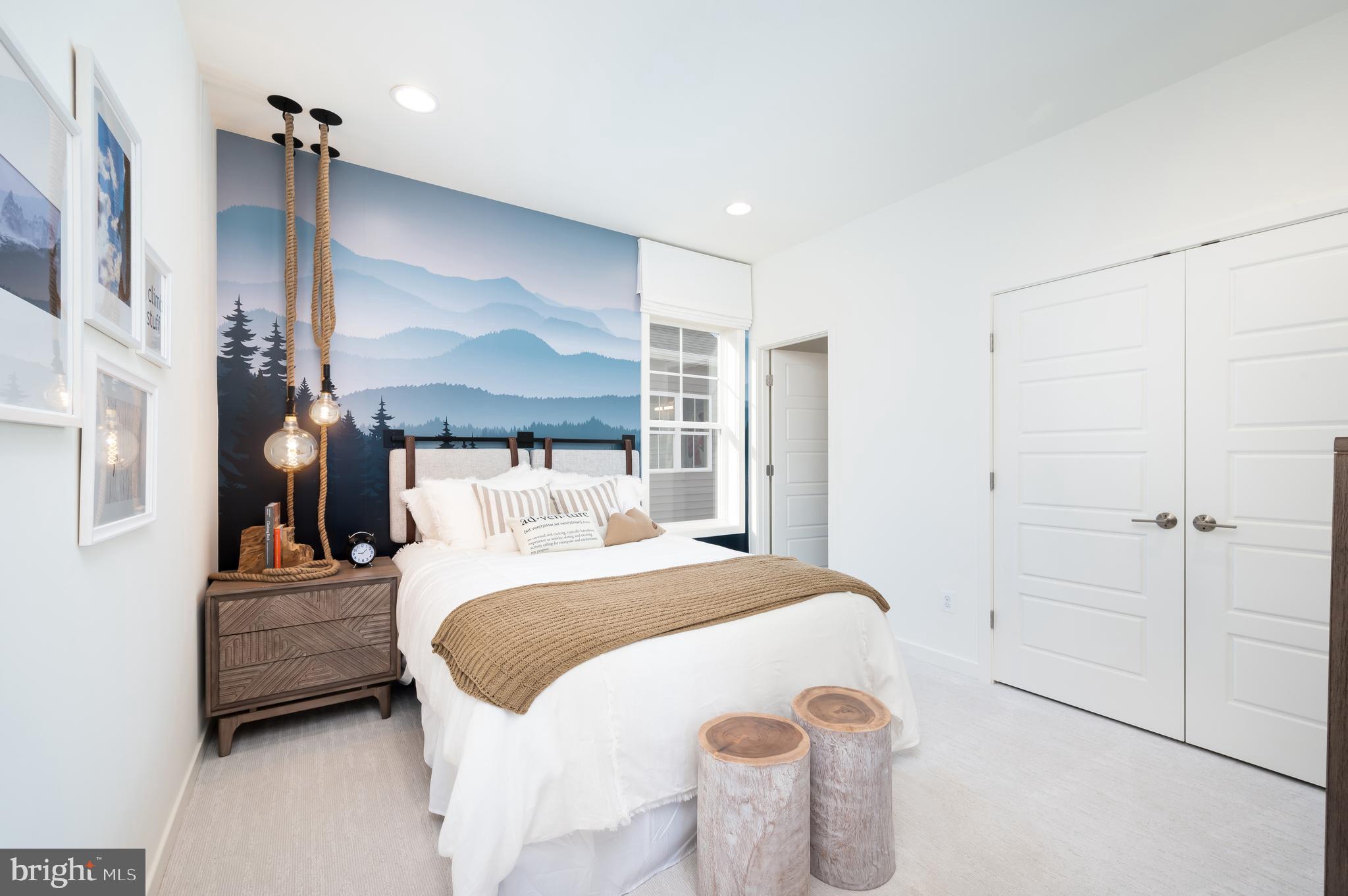 42108 Creighton Road Ashburn, VA 20148 - Photo 28 of 39 a bedroom with a bed and a chandelier