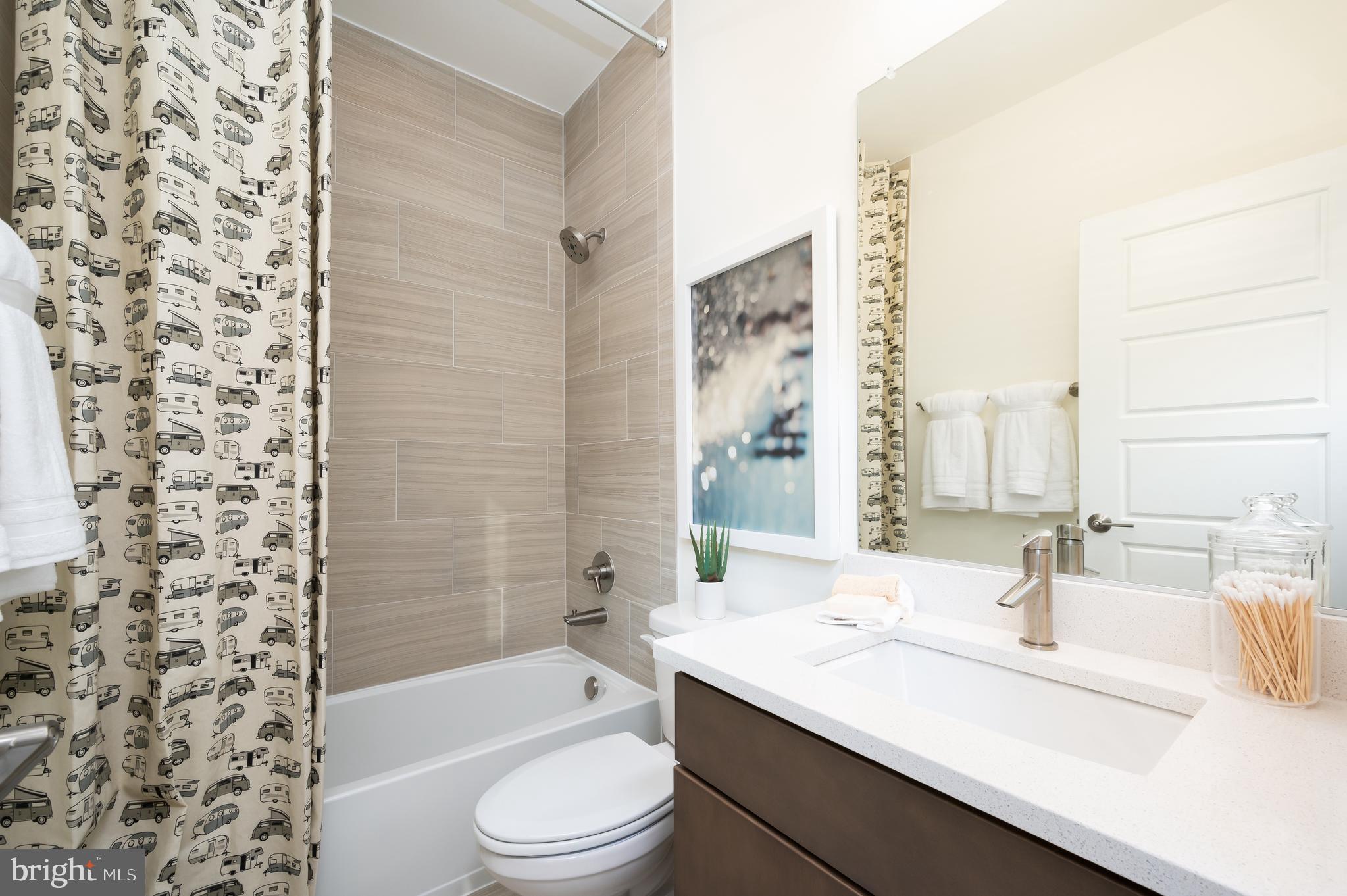 42108 Creighton Road Ashburn, VA 20148 - Photo 29 of 39 a bathroom with a sink a toilet and shower