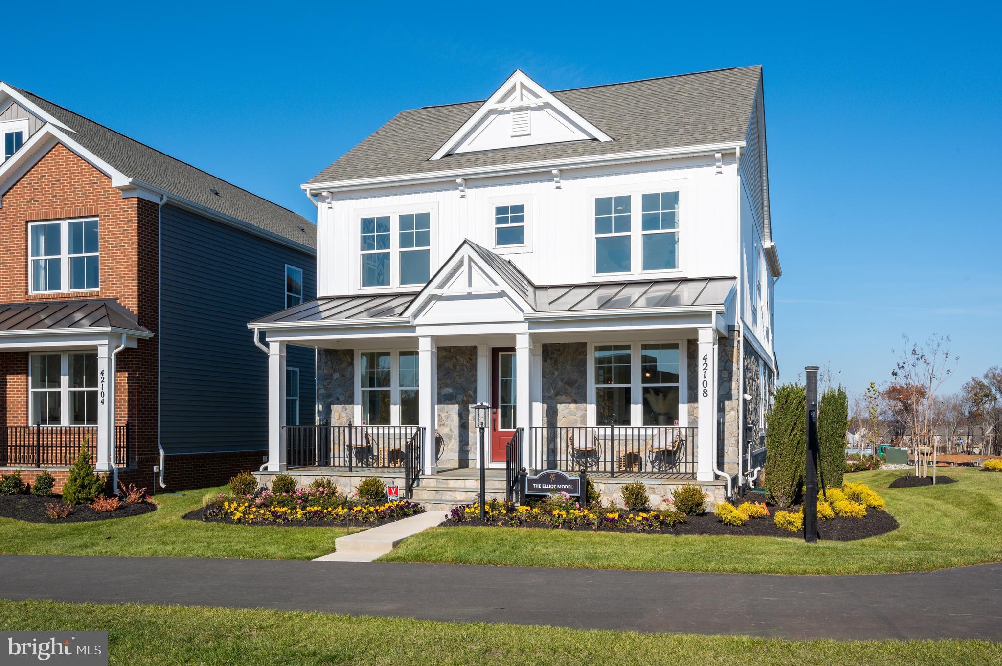 42108 Creighton Road Ashburn, VA 20148 - Photo 3 of 39 a front view of a house with garden