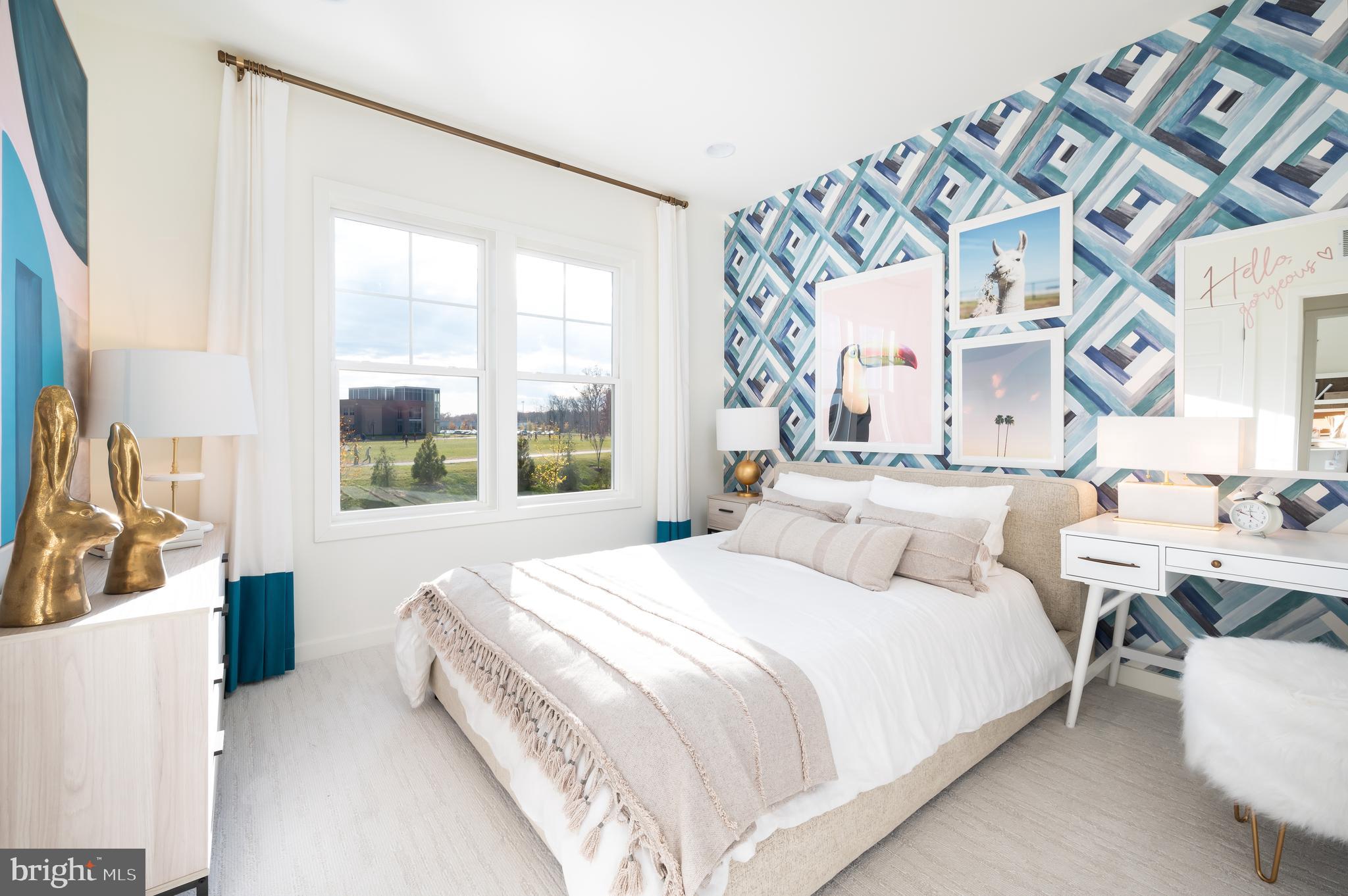 42108 Creighton Road Ashburn, VA 20148 - Photo 31 of 39 a large bed sitting in a bedroom next to a window