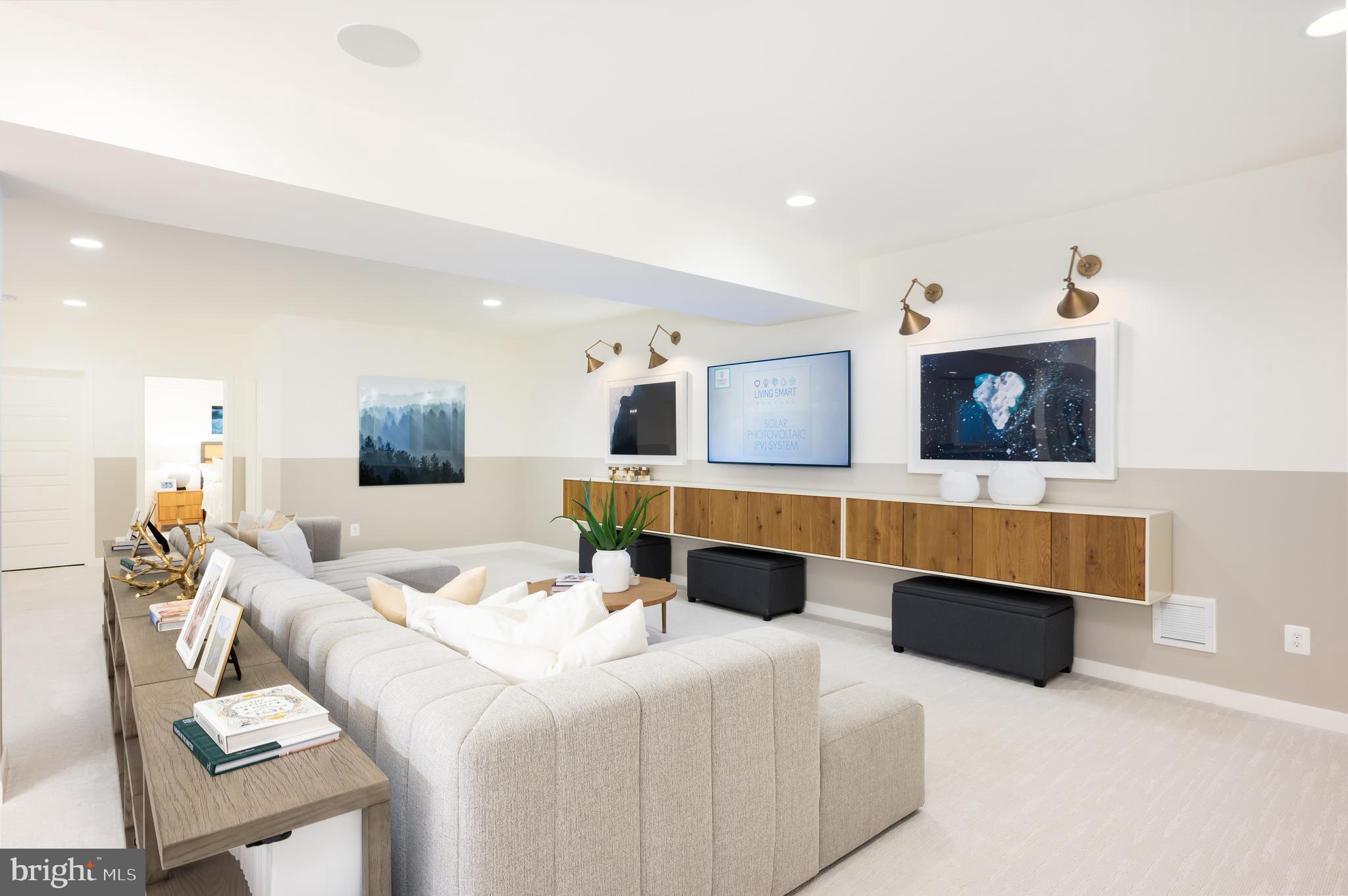 42108 Creighton Road Ashburn, VA 20148 - Photo 35 of 39 a living room with furniture and a flat screen tv