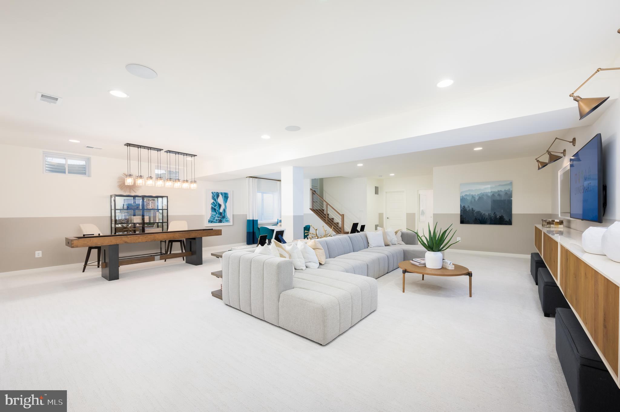 42108 Creighton Road Ashburn, VA 20148 - Photo 36 of 39 a living room with furniture and a table