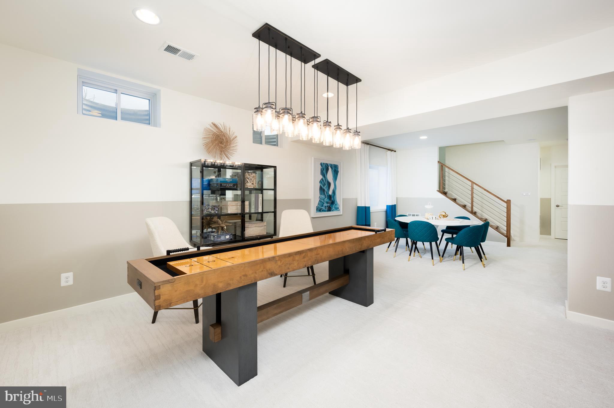 42108 Creighton Road Ashburn, VA 20148 - Photo 37 of 39 a living room with furniture and a chandelier