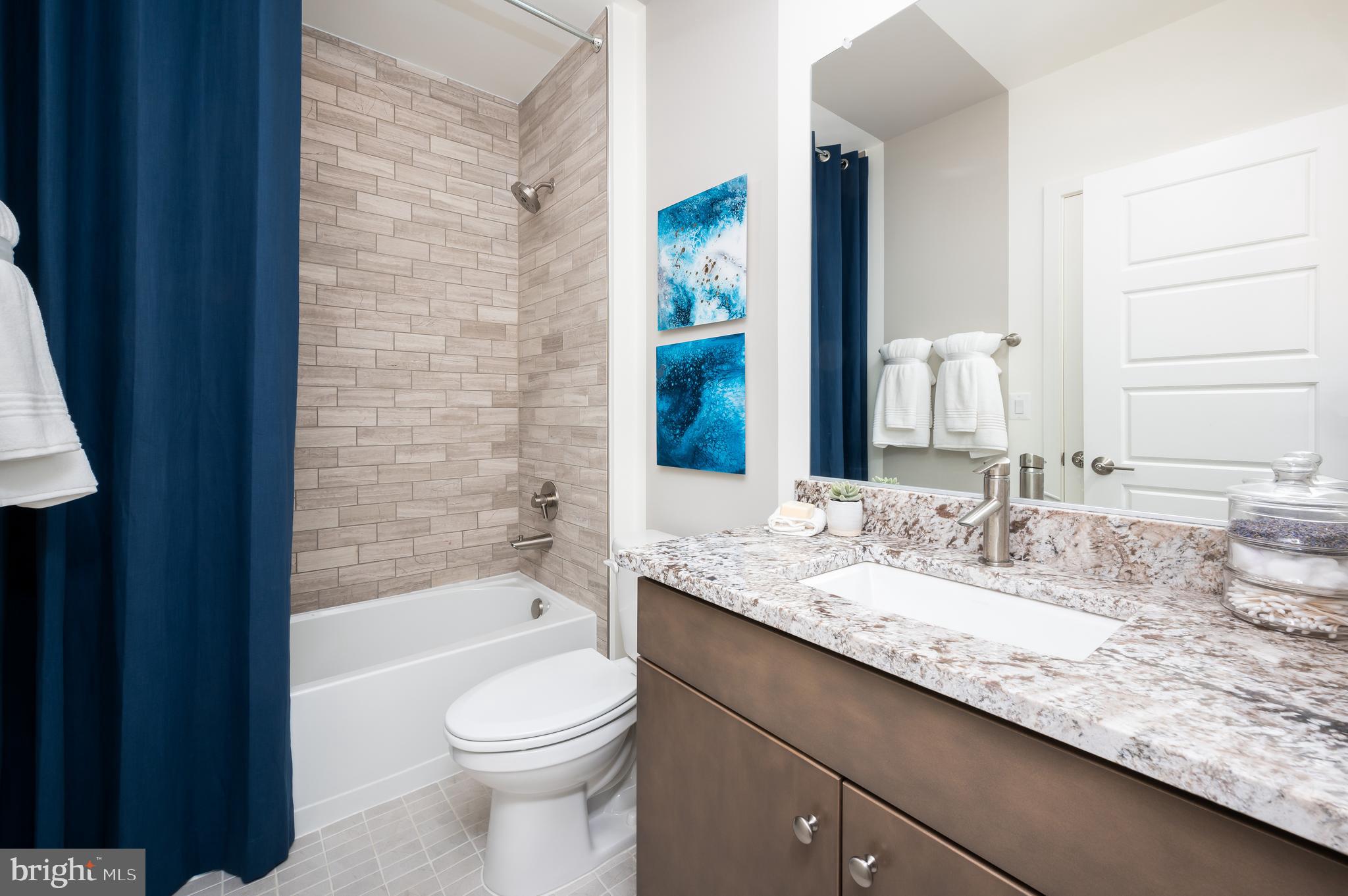 42108 Creighton Road Ashburn, VA 20148 - Photo 39 of 39 a bathroom with a granite countertop sink toilet and shower