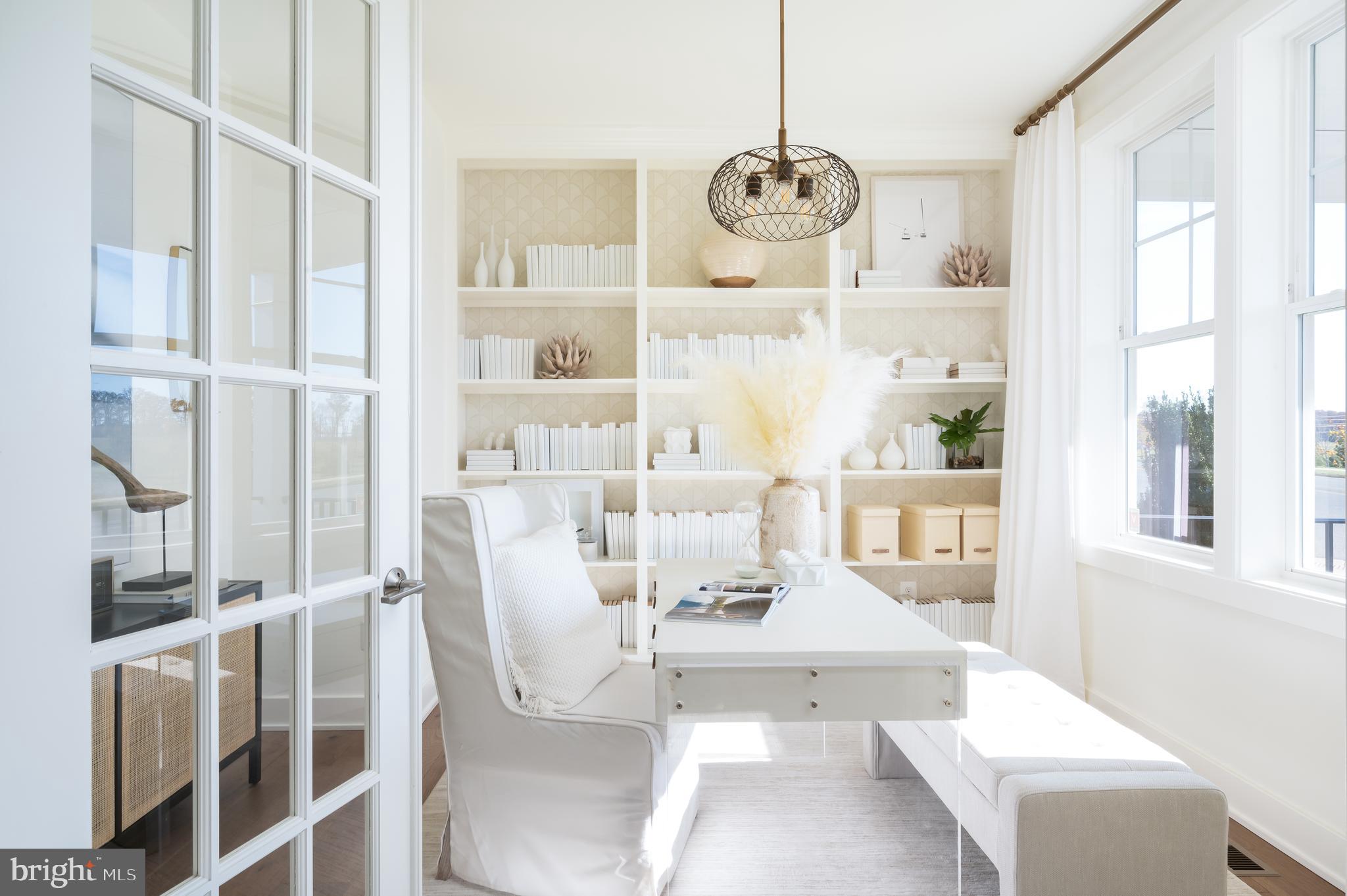 42108 Creighton Road Ashburn, VA 20148 - Photo 5 of 39 a view of dining room and kitchen with windows