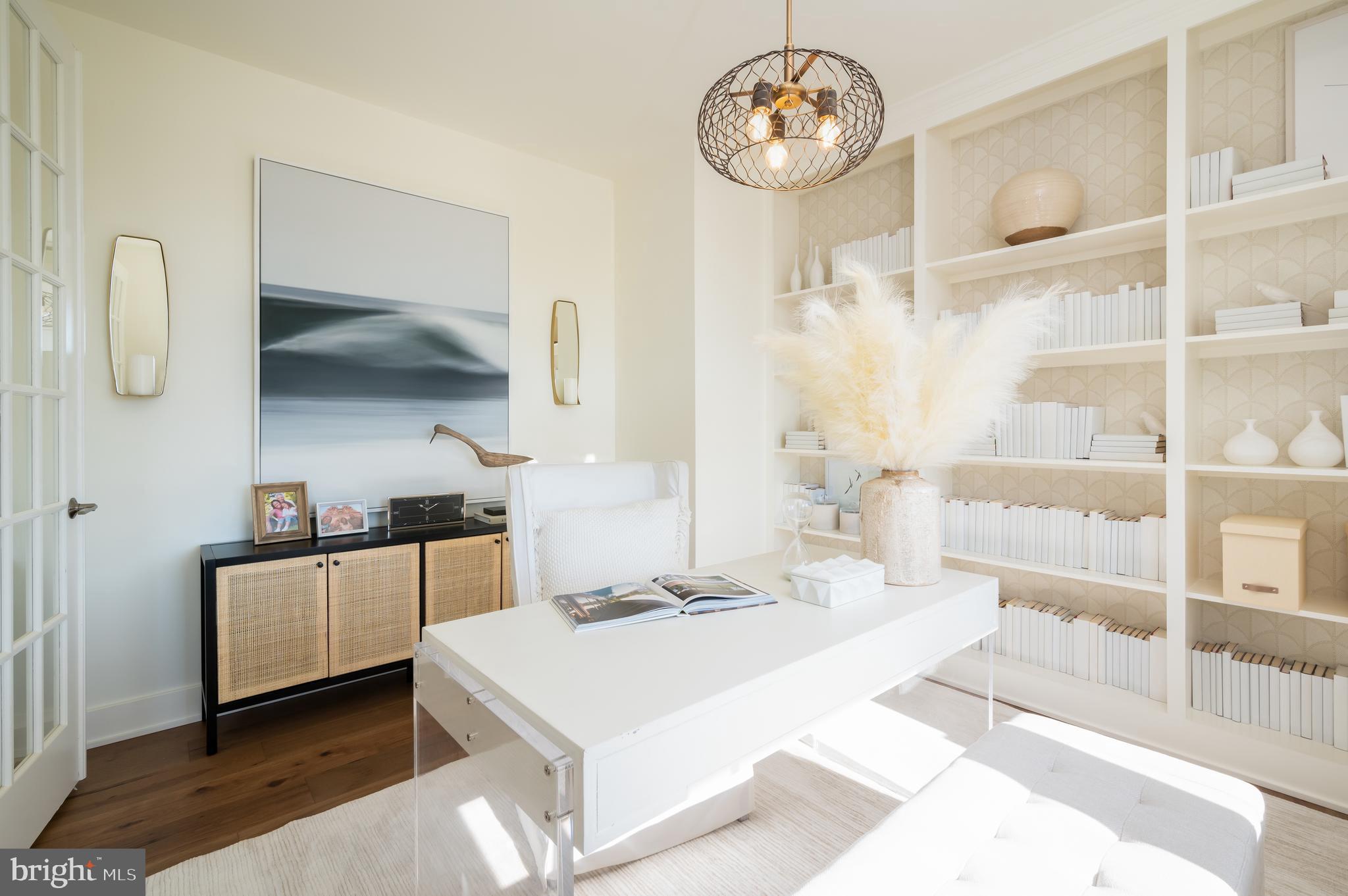 42108 Creighton Road Ashburn, VA 20148 - Photo 6 of 39 a kitchen with a stove and a clock on the wall