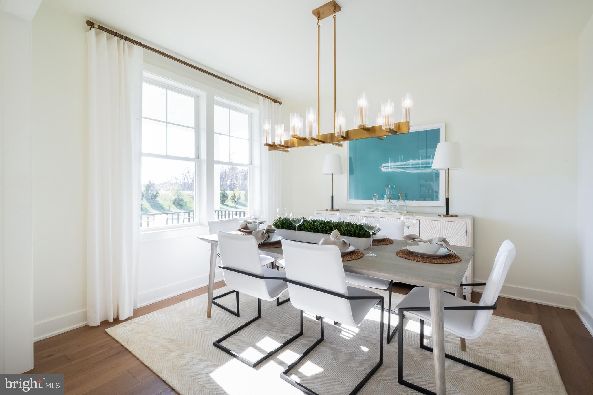 42108 Creighton Road Ashburn, VA 20148 - Photo 7 of 39 a view of a dining room with furniture window and wooden floor