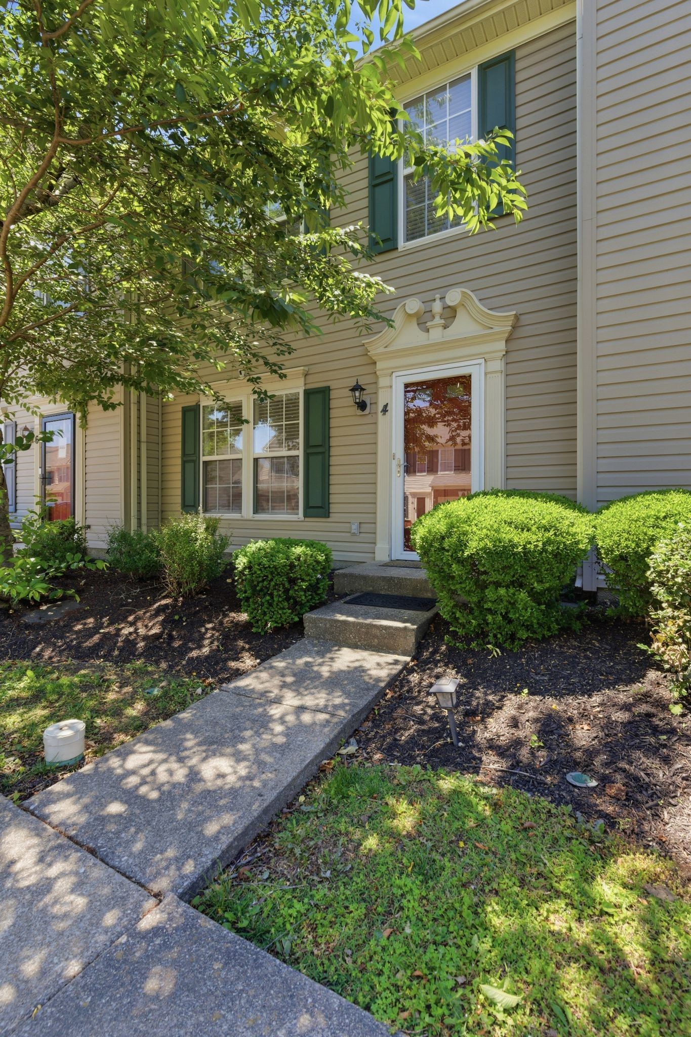 3401 Anderson Road, Unit 4 Antioch, TN 37013 - Photo 7 of 55 a front view of a house with garden