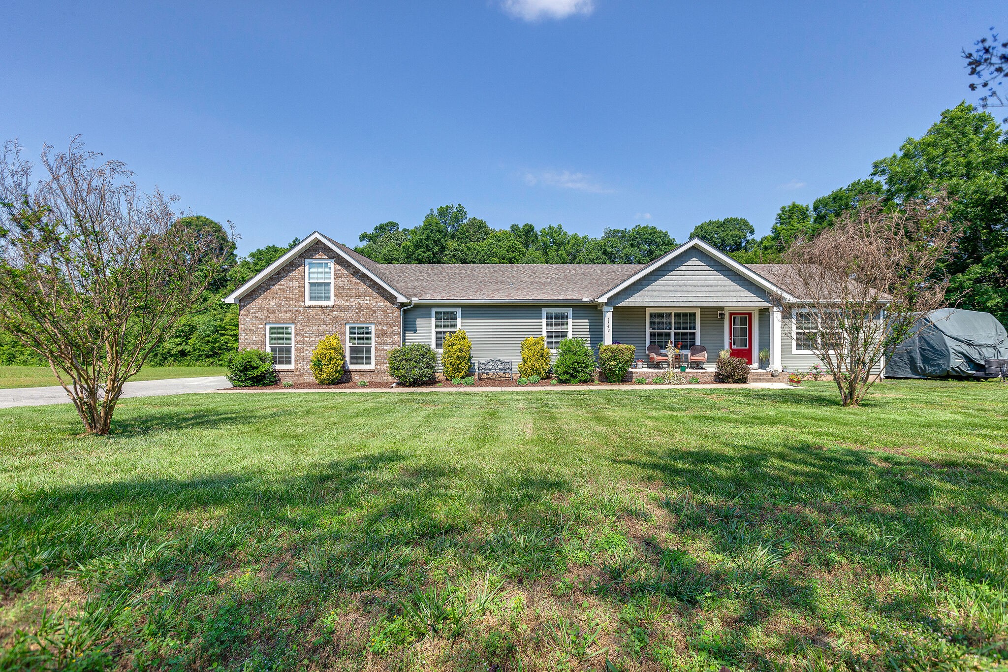 3349 Mahlon Moore Road Spring Hill, TN 37174 - Photo 1 of 28 a front view of a house with yard and green space