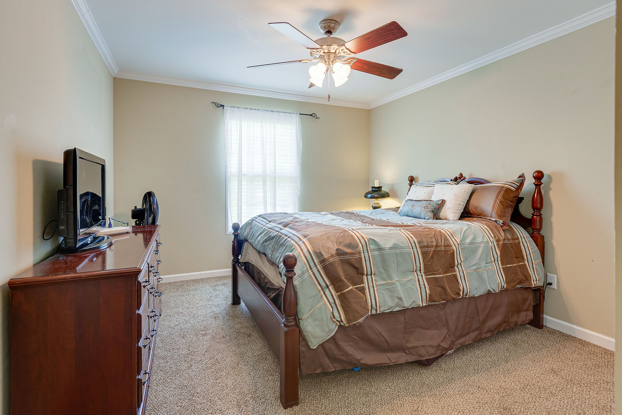 3349 Mahlon Moore Road Spring Hill, TN 37174 - Photo 20 of 28 a bedroom with a bed and a flat screen tv
