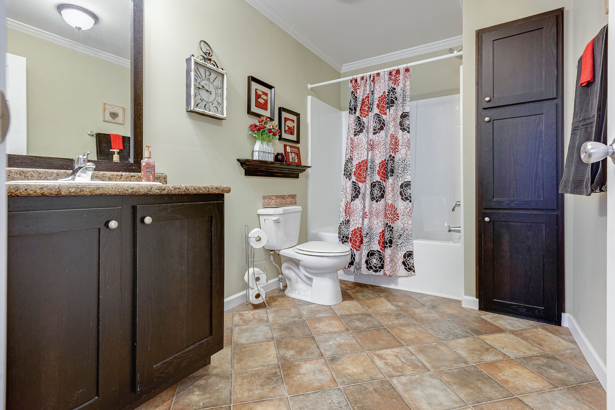 3349 Mahlon Moore Road Spring Hill, TN 37174 - Photo 21 of 28 a bathroom with a sink a toilet and shower curtain