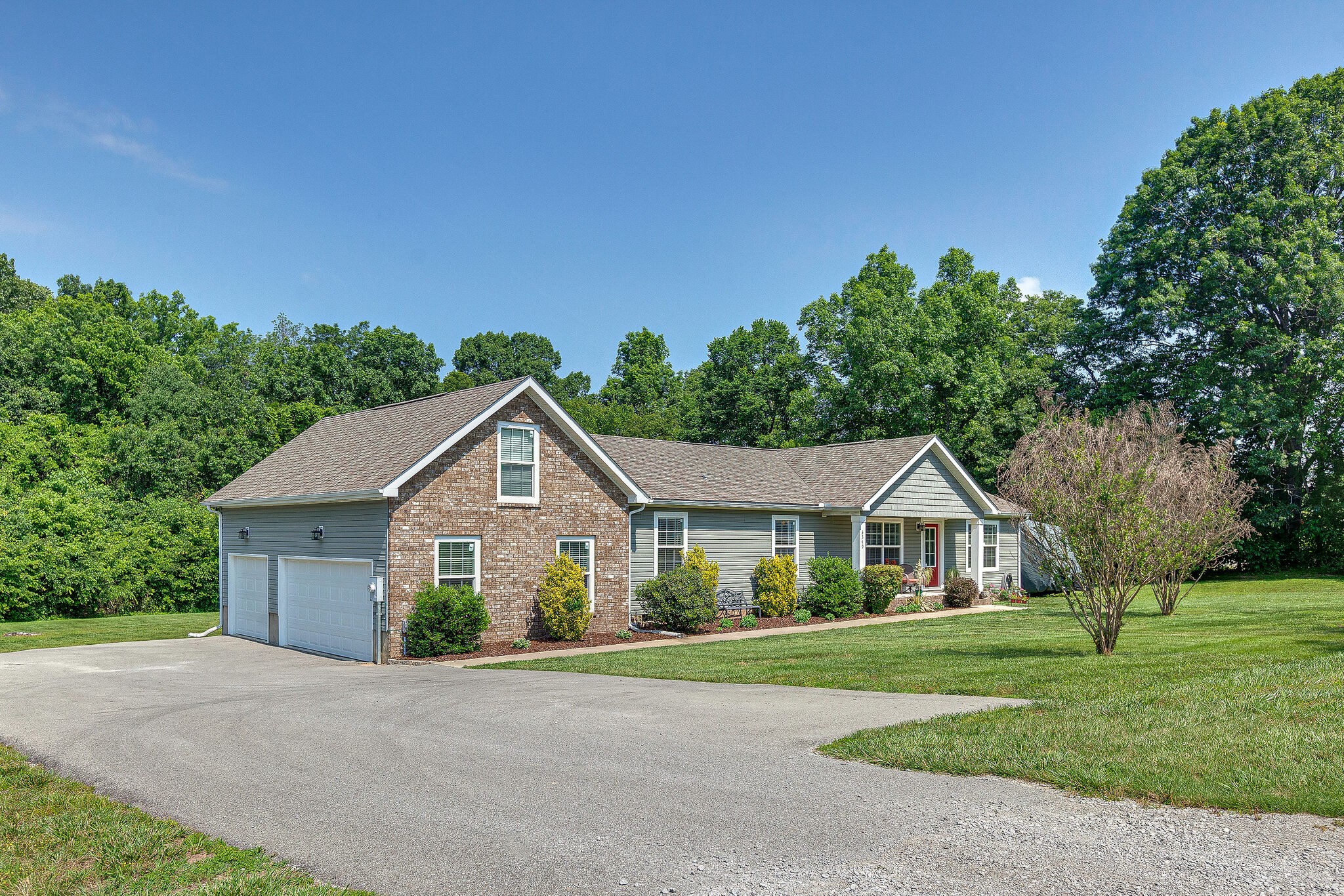 3349 Mahlon Moore Road Spring Hill, TN 37174 - Photo 3 of 28 a front view of a house with a yard
