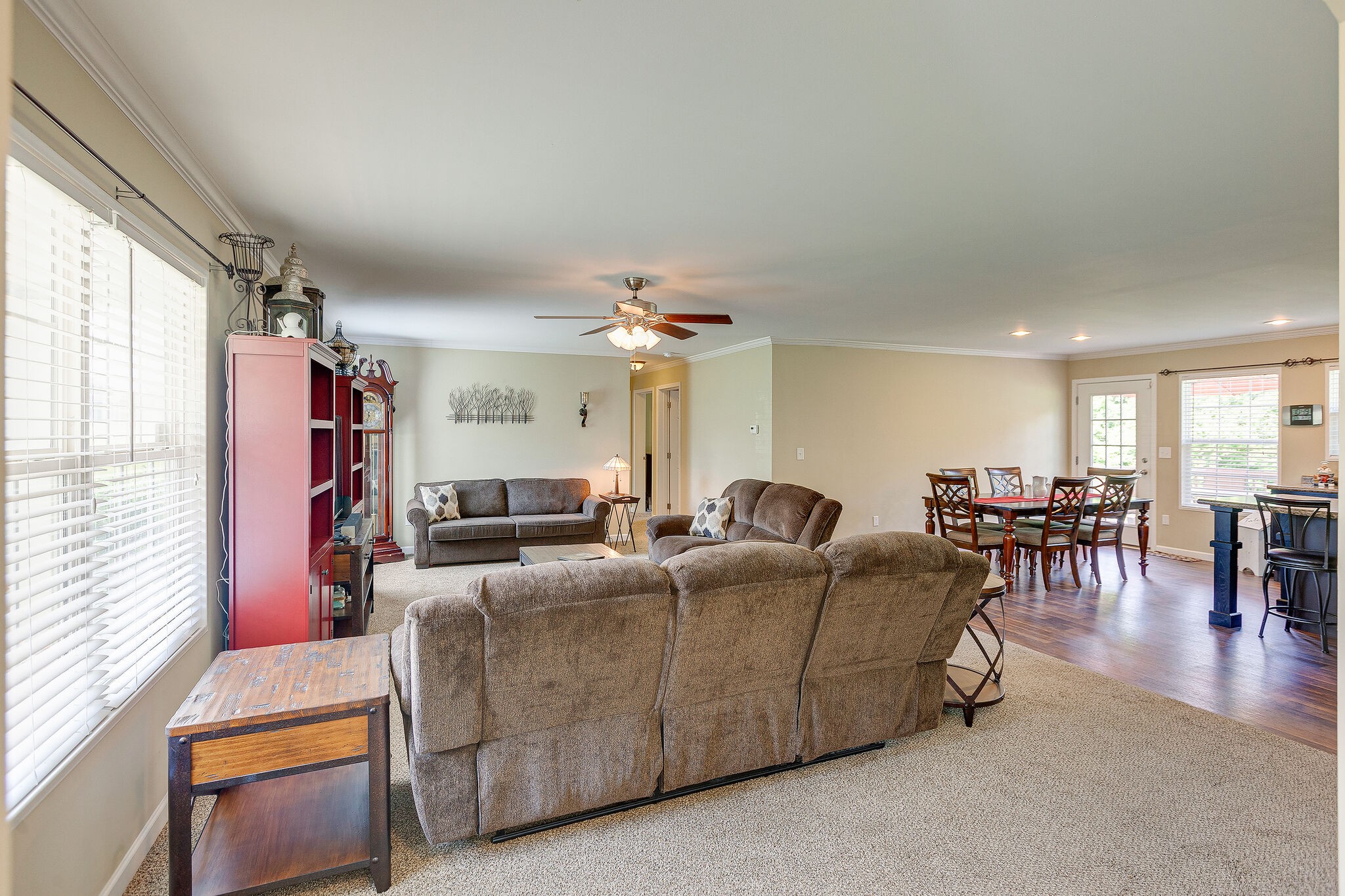 3349 Mahlon Moore Road Spring Hill, TN 37174 - Photo 6 of 28 a living room with furniture a dining table and a fireplace