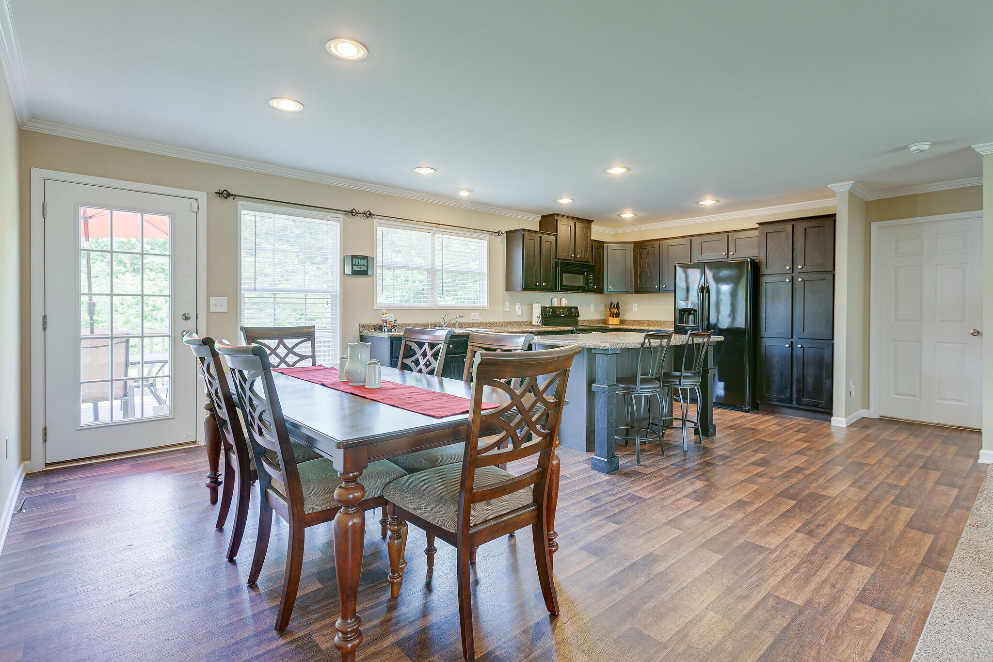 3349 Mahlon Moore Road Spring Hill, TN 37174 - Photo 10 of 28 a view of a dining room with furniture and wooden floor