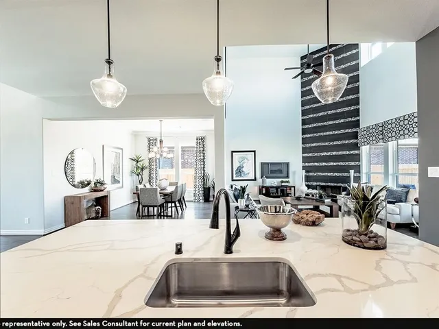 a view of a living room and kitchen