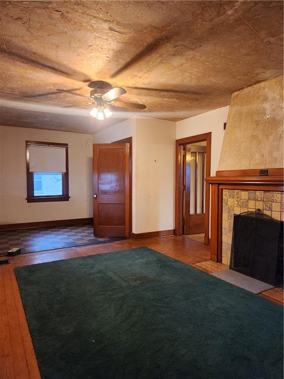 1100 Old State Road Apollo, PA 15613 - Photo 6 of 16 a view of empty room with wooden floor and fireplace
