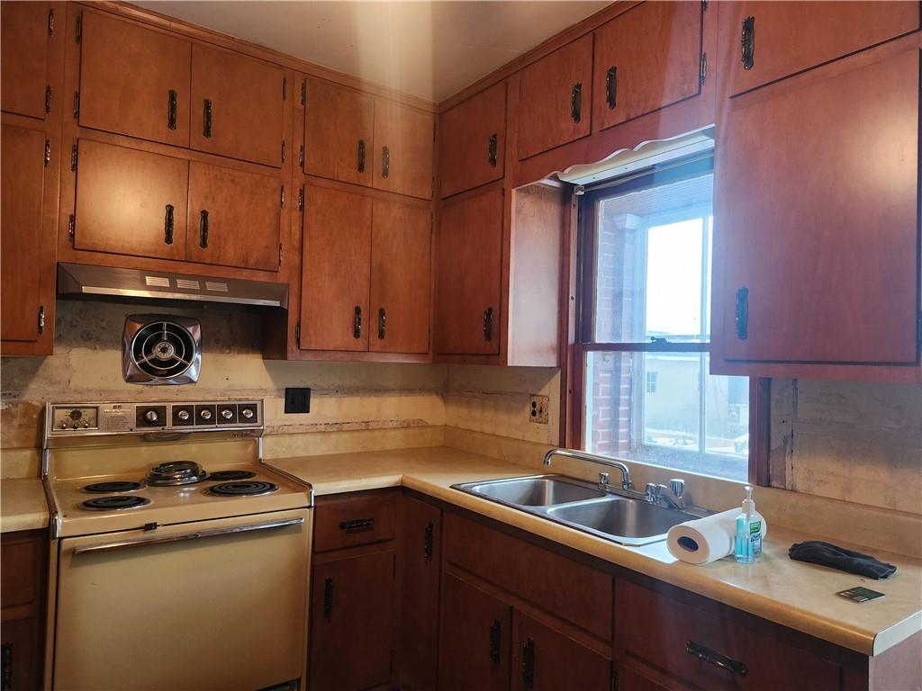 1100 Old State Road Apollo, PA 15613 - Photo 7 of 16 a kitchen with a stove a sink and cabinets