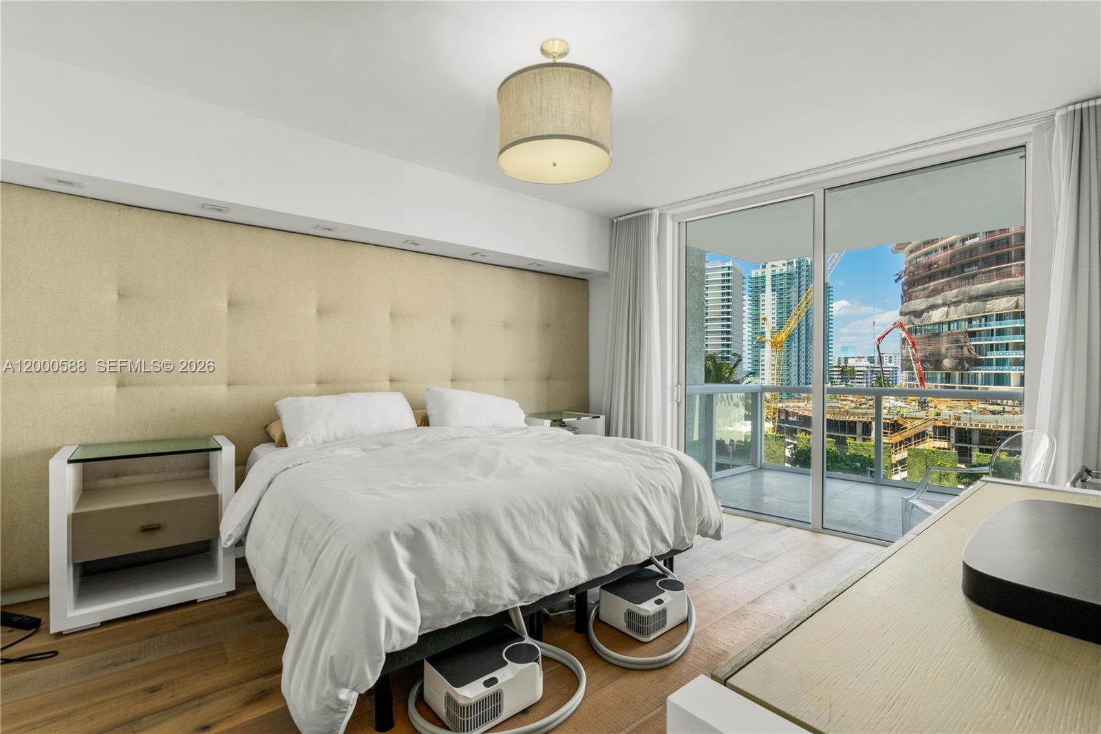 450 Alton Road, Unit 806 Miami Beach, FL 33139 - Photo 16 of 23 a bedroom with a bed and a window