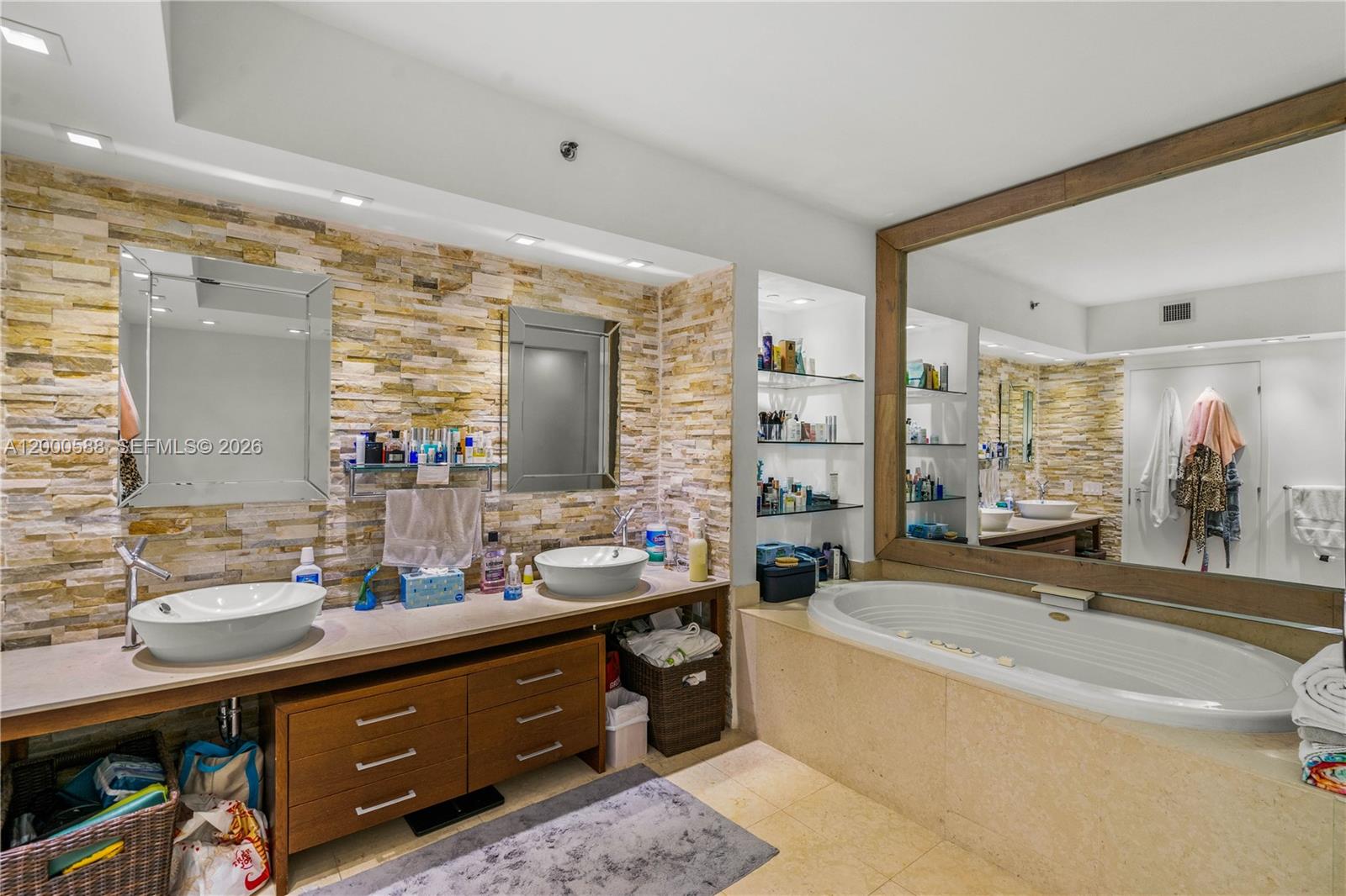450 Alton Road, Unit 806 Miami Beach, FL 33139 - Photo 20 of 23 a bathroom with a tub sink and mirror
