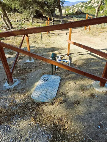 a view of water covered with snow in the background
