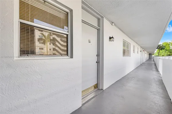 a kitchen with a sink stove and refrigerator