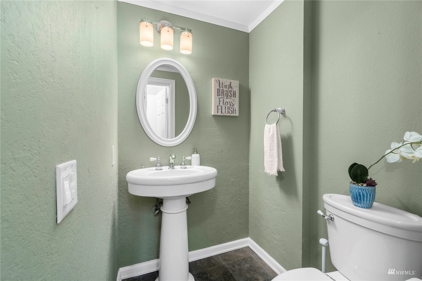 1800 Grant Avenue South, Unit D2 Renton, WA 98055 - Photo 14 of 23 a bathroom with a sink a mirror and a toilet