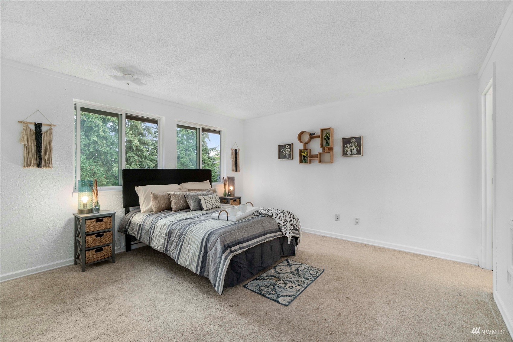 1800 Grant Avenue South, Unit D2 Renton, WA 98055 - Photo 15 of 23 a bedroom with a bed and a painting on the wall