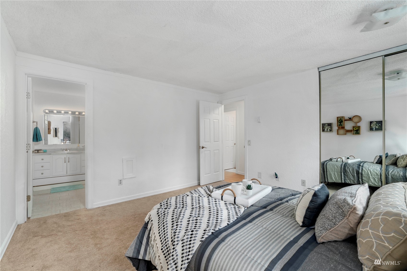 1800 Grant Avenue South, Unit D2 Renton, WA 98055 - Photo 16 of 23 a bedroom with a bed and walk in closet