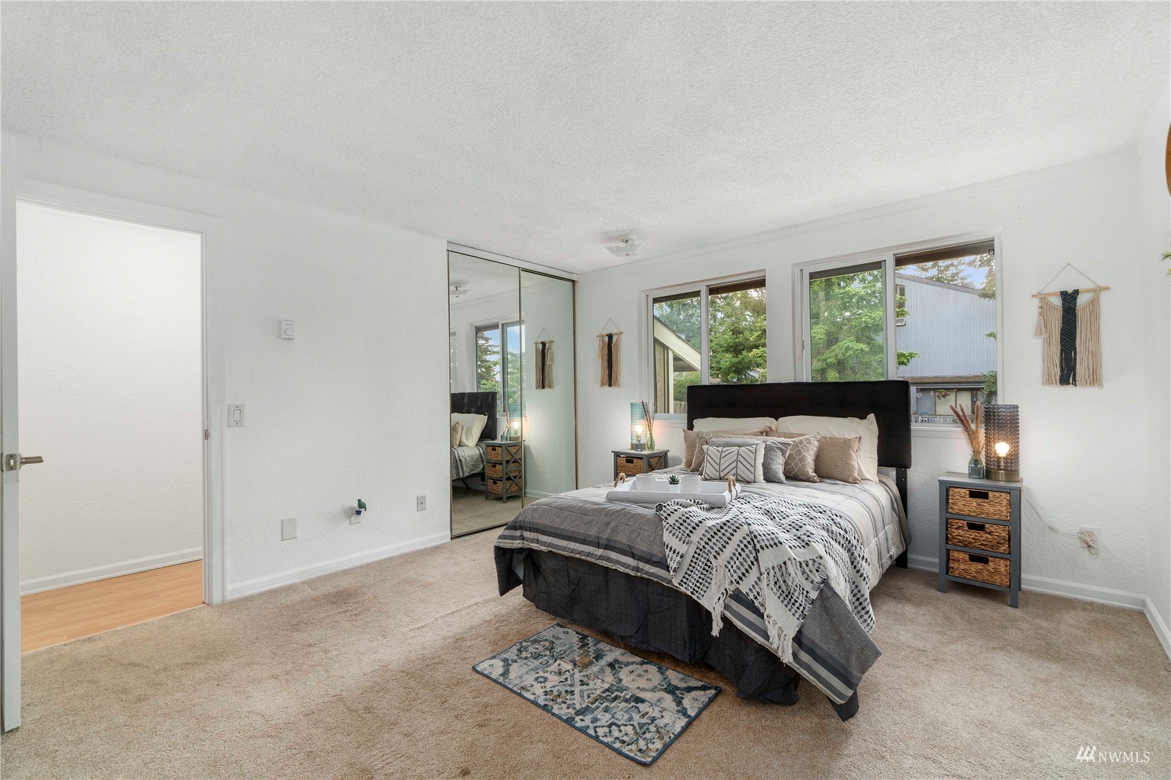 1800 Grant Avenue South, Unit D2 Renton, WA 98055 - Photo 18 of 23 a bedroom with a bed and a night stand