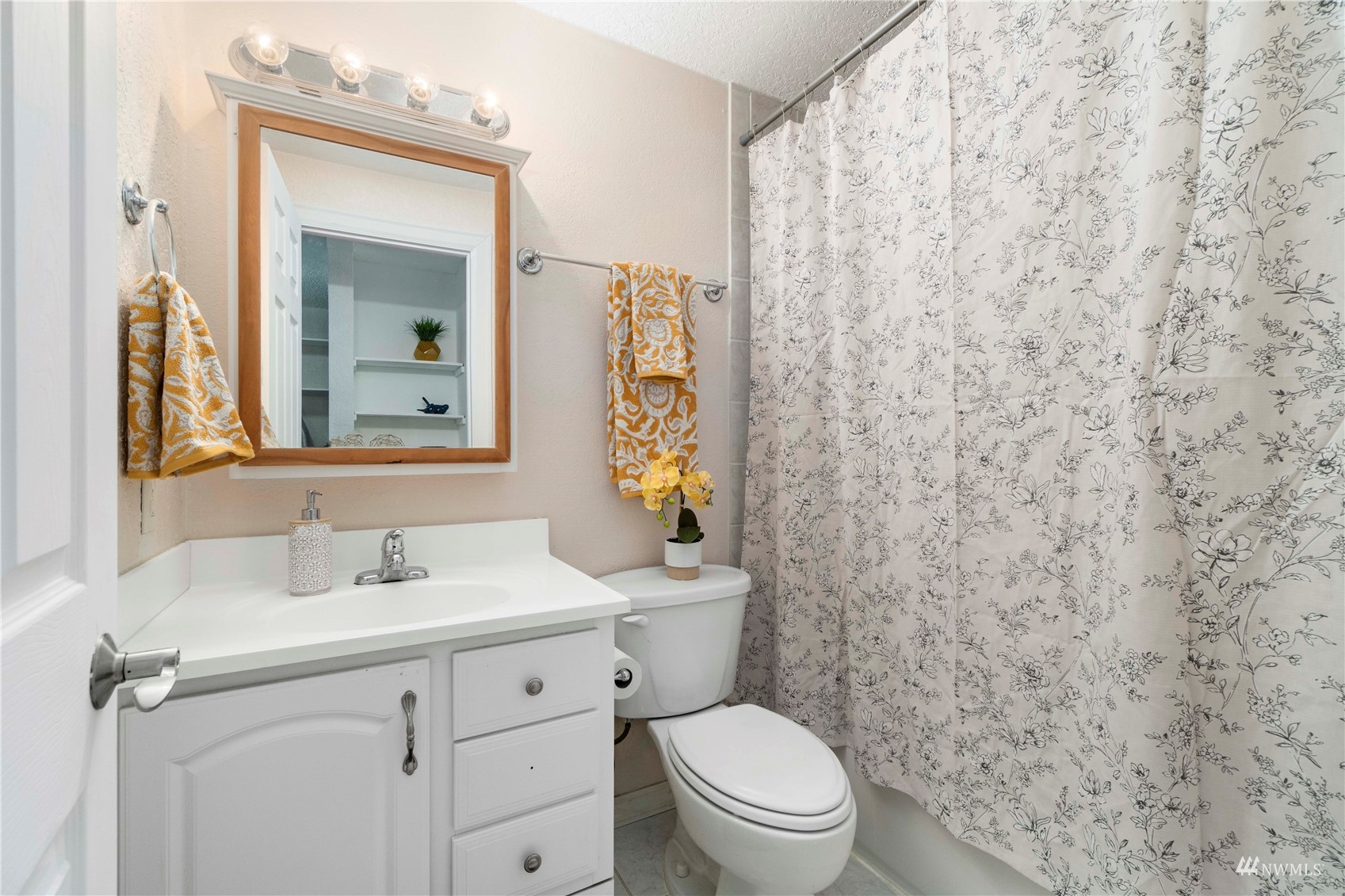 1800 Grant Avenue South, Unit D2 Renton, WA 98055 - Photo 19 of 23 a bathroom with a toilet sink and mirror