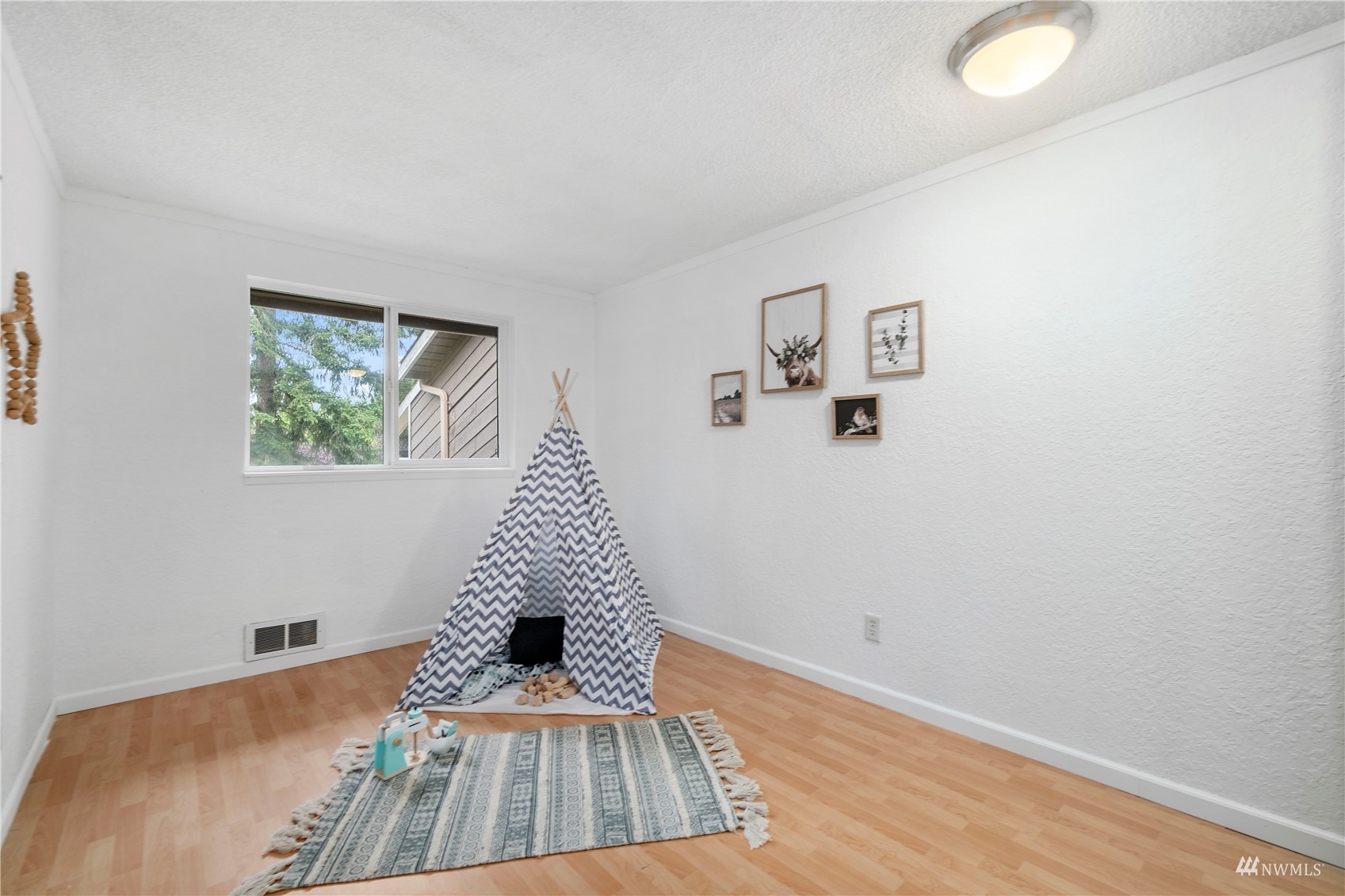 1800 Grant Avenue South, Unit D2 Renton, WA 98055 - Photo 21 of 23 a view of a bedroom with wooden floor and window