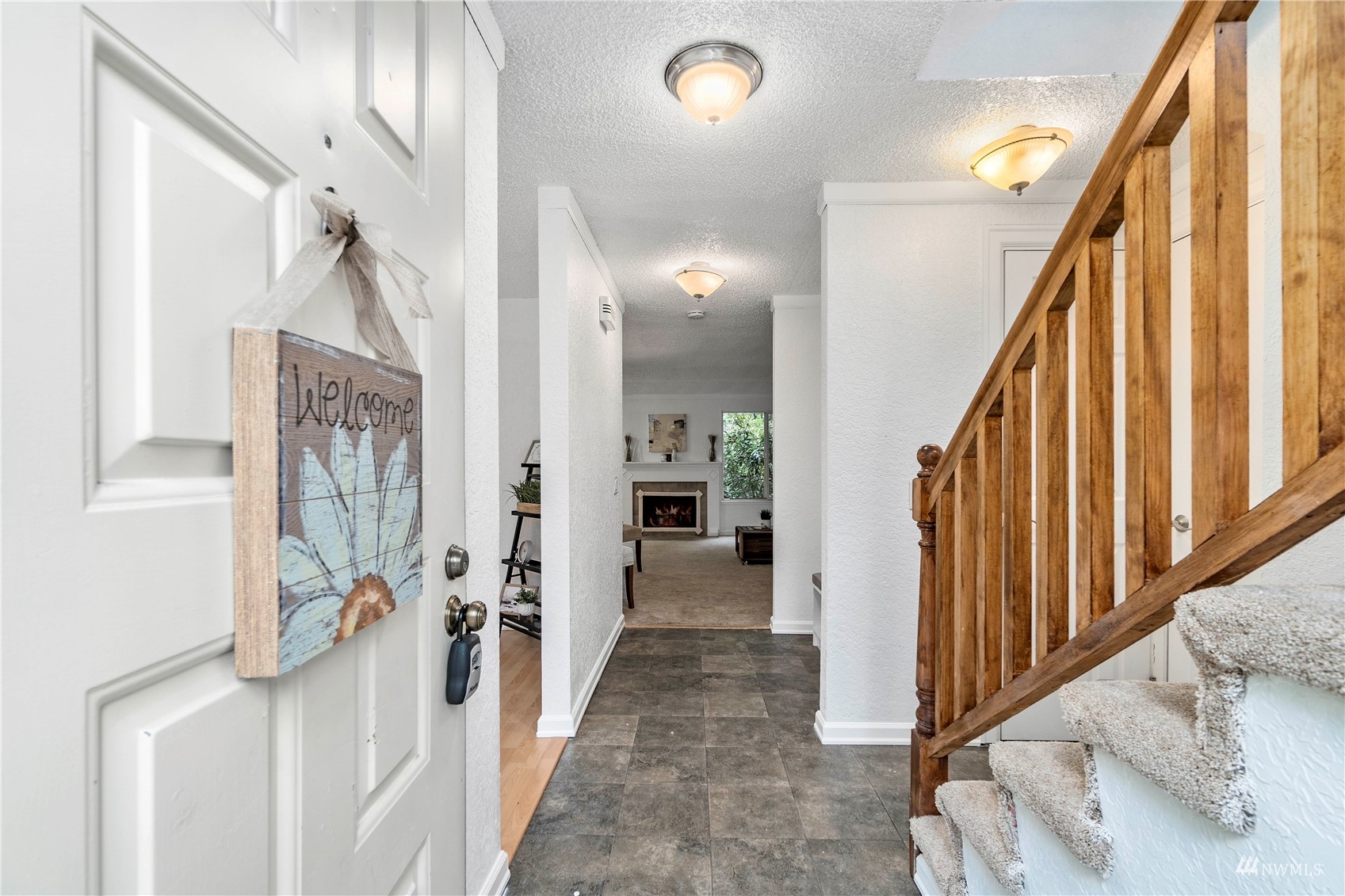 1800 Grant Avenue South, Unit D2 Renton, WA 98055 - Photo 3 of 23 a view of a hallway with wooden floor and staircase